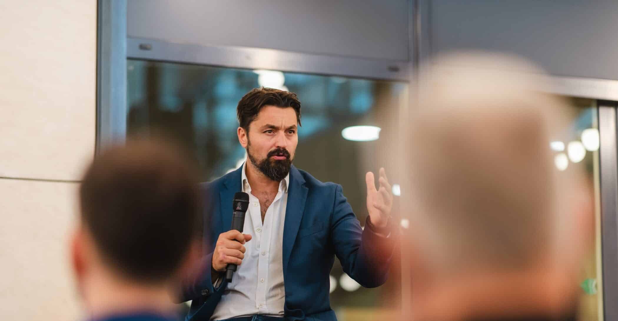 Adrian speaking at event